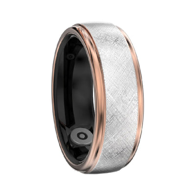 Multicolored ring with black, rose gold, and silver bands on a white background